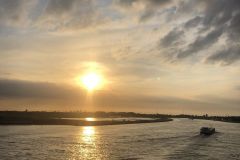 Zonsondergang vanaf de brug over de Noord